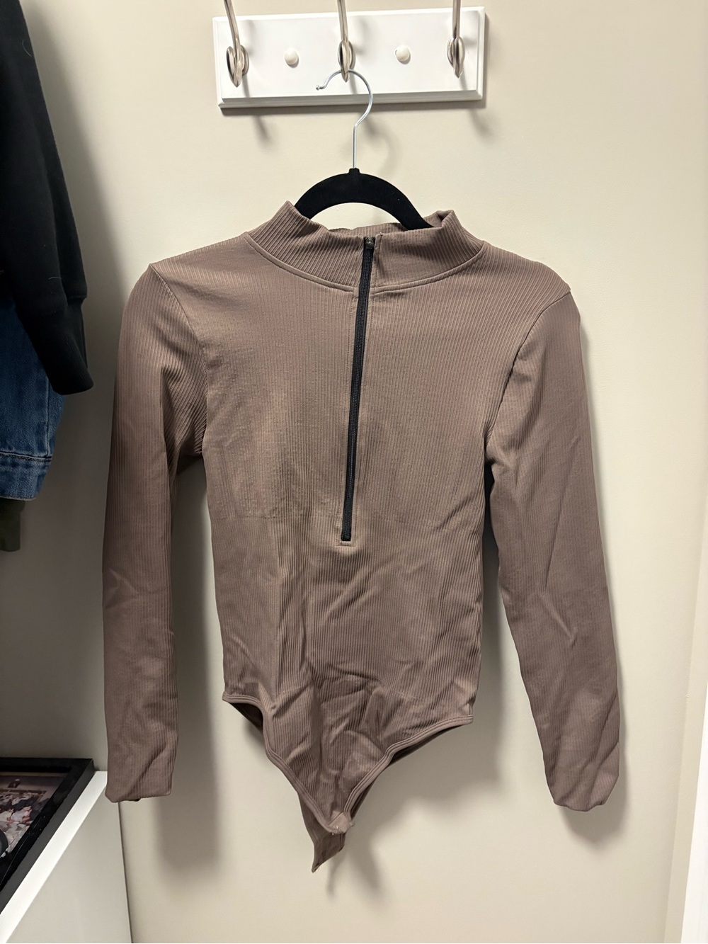 OQQ Long-Sleeve Ribbed One-Piece Bodysuit in Taupe